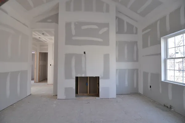 a view of an empty room with a fireplace