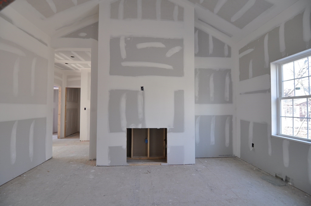 1 Depot Street, Unit 1 Townsend, MA 01469 - Photo 8 of 26 a view of an empty room with a fireplace