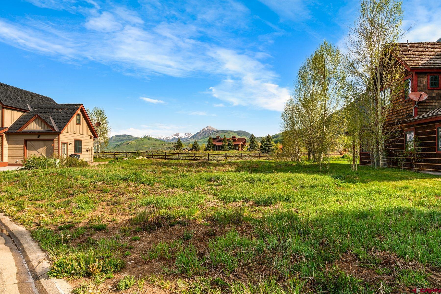 140 Alpine Court Crested Butte, CO 81224 - Photo 2 of 19 a view of a house with a yard
