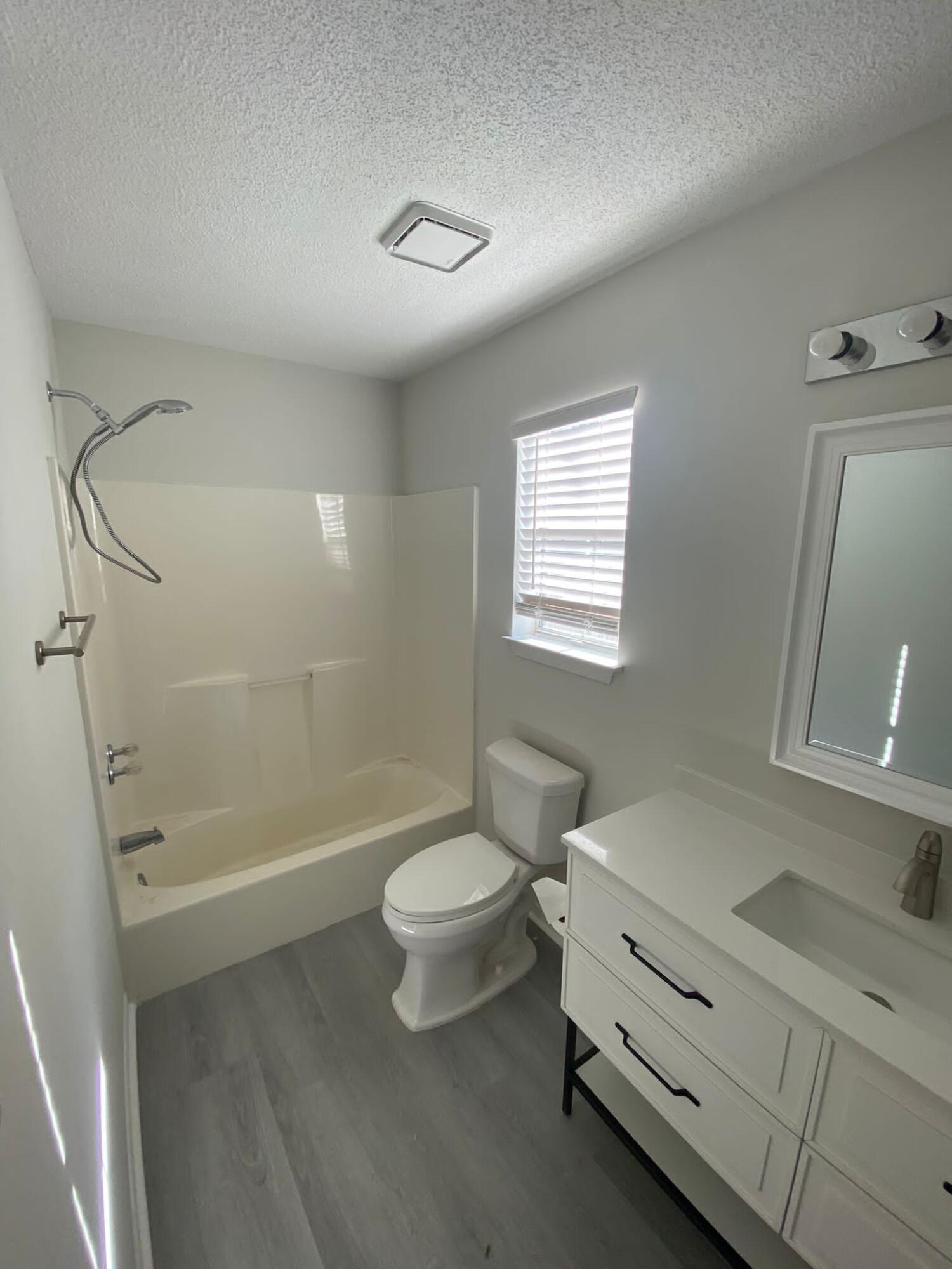 407 Apple Drive Crestview, FL 32536 - Photo 16 of 28 a bathroom with a sink a toilet and shower