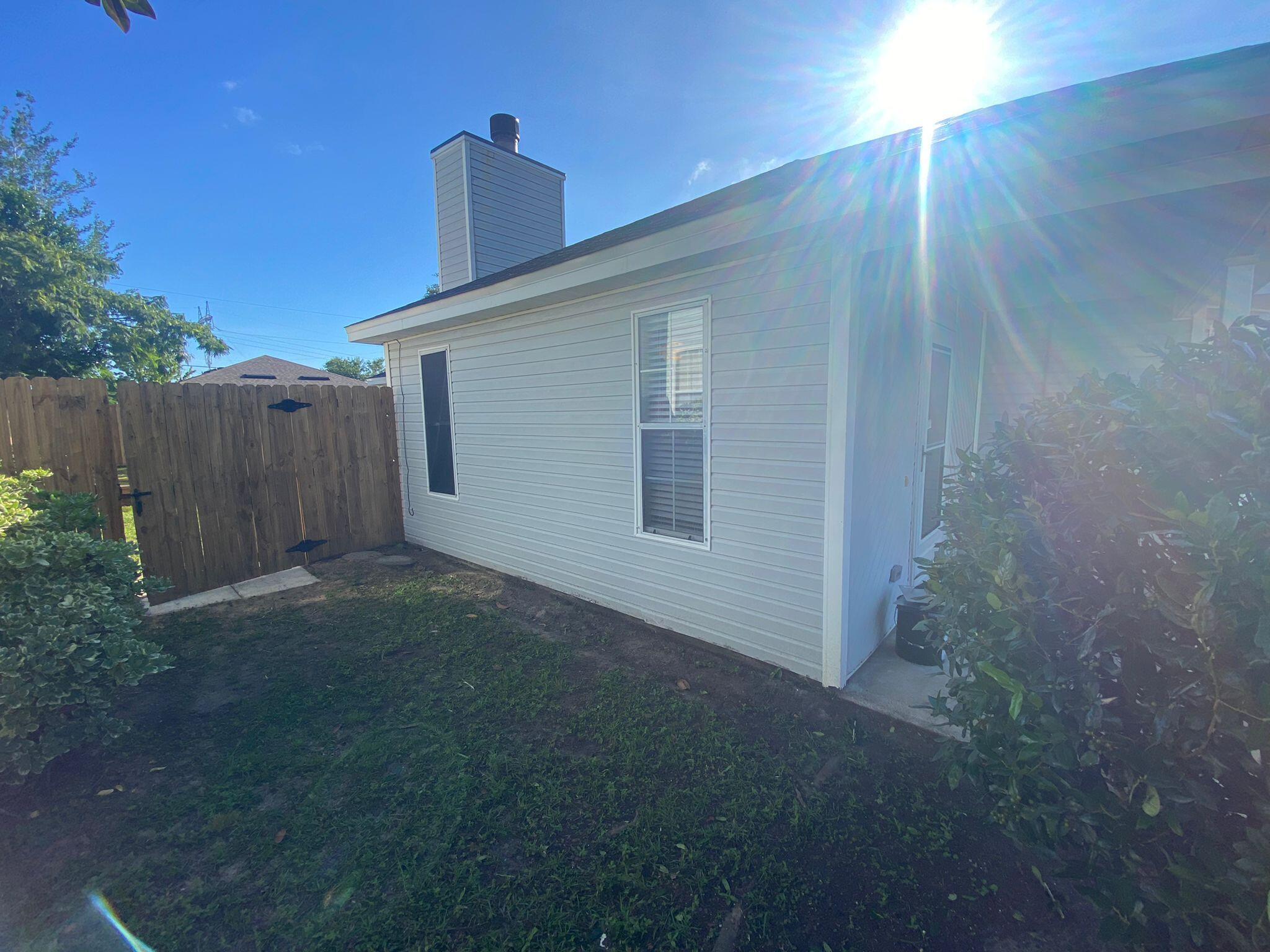 407 Apple Drive Crestview, FL 32536 - Photo 25 of 28 a view of a house with a backyard