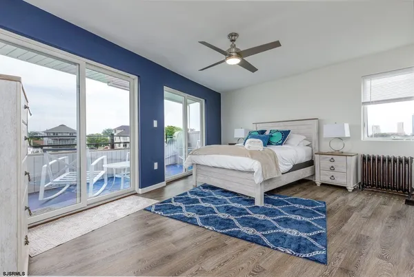 a bedroom with a bed and a mirror