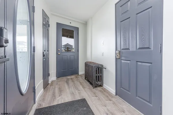 a room with a dresser and a television