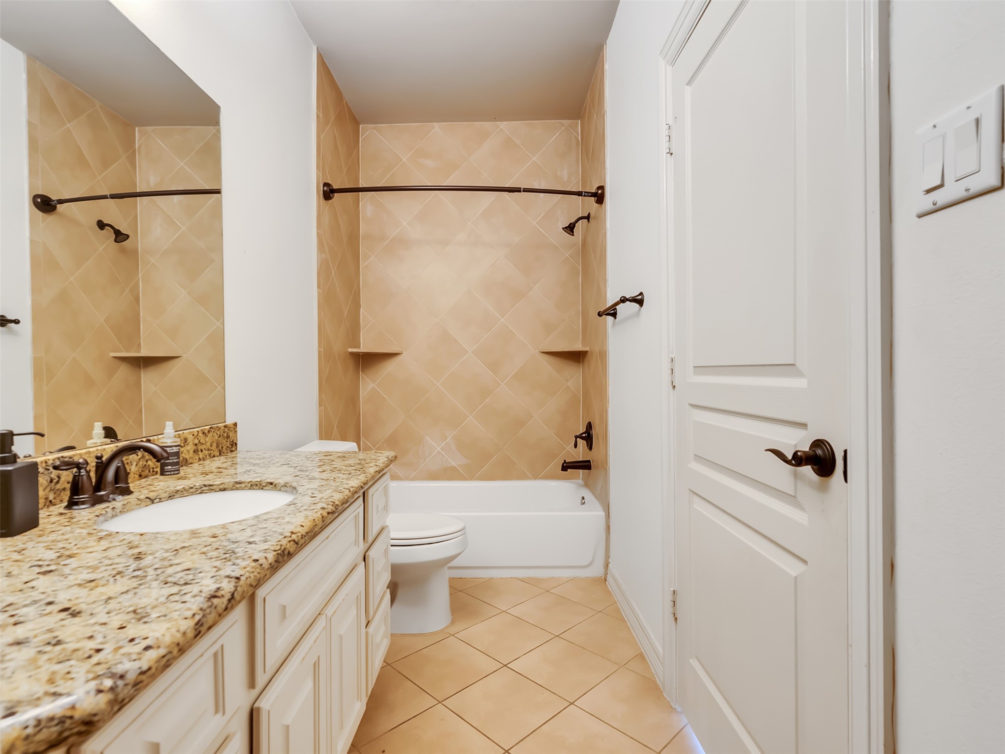 2540 Prospect Street, Unit B Houston, TX 77004 - Photo 30 of 37 a bathroom with a granite countertop sink a toilet and shower