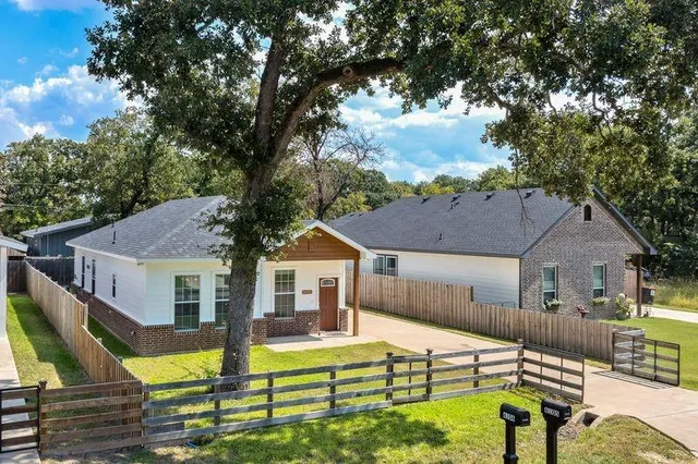 a view of house with outdoor seating area