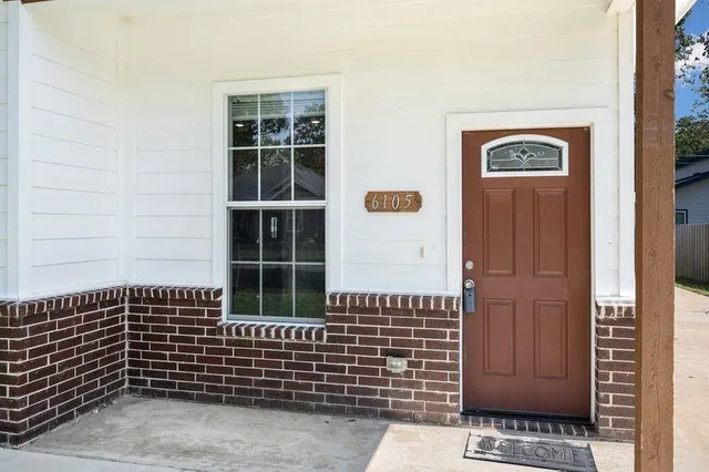 a view of a door with wooden floor