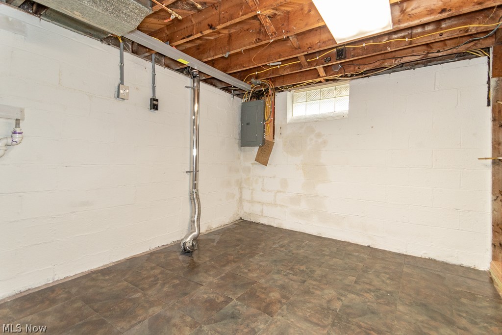 4210 Redfern Road Parma, OH 44134 - Photo 38 of 46 Basement with dark tile patterned floors and electric panel