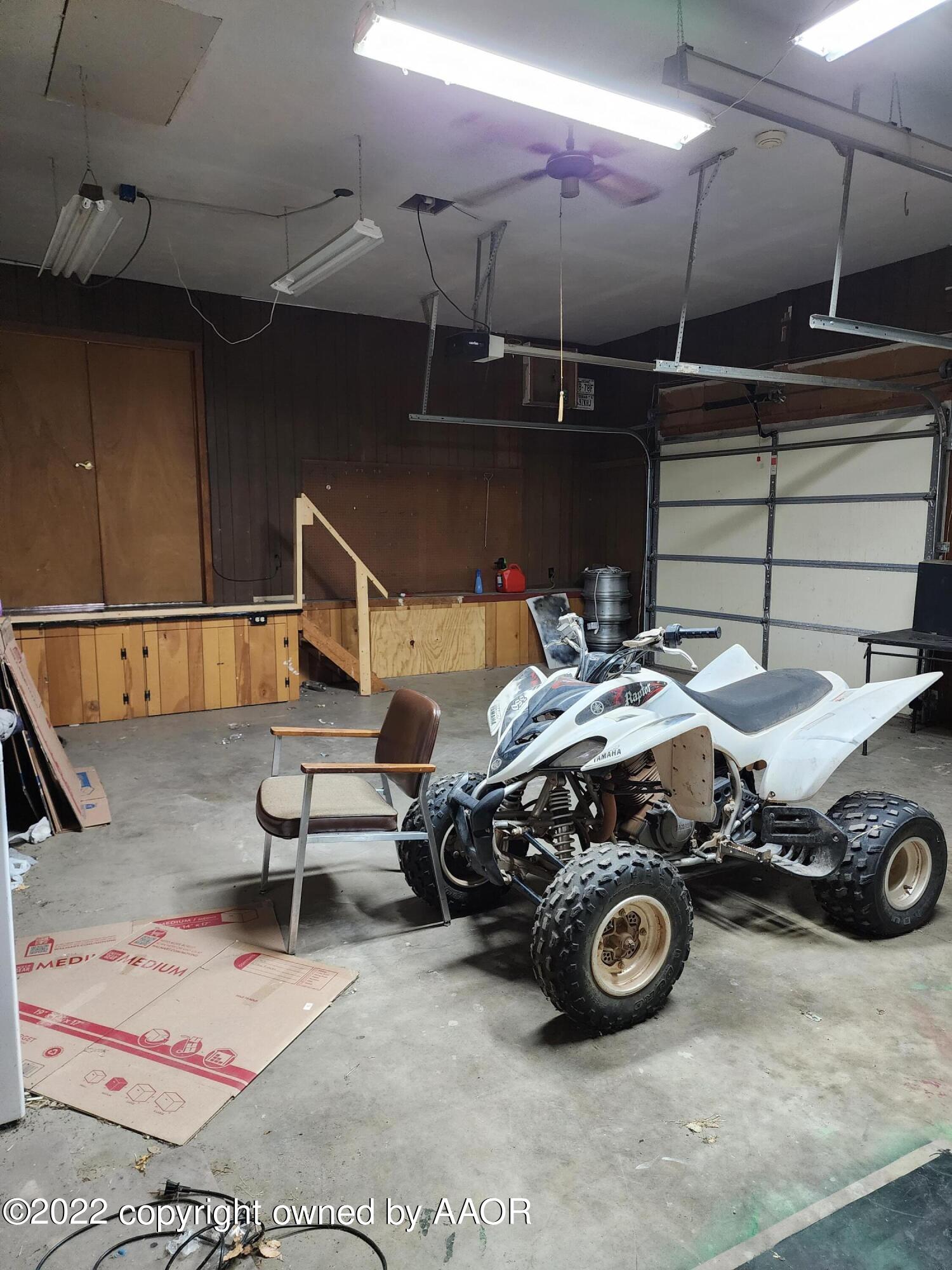 120 Pinon Street Borger, TX 79007 - Photo 19 of 19 a car and bike parked in a garage