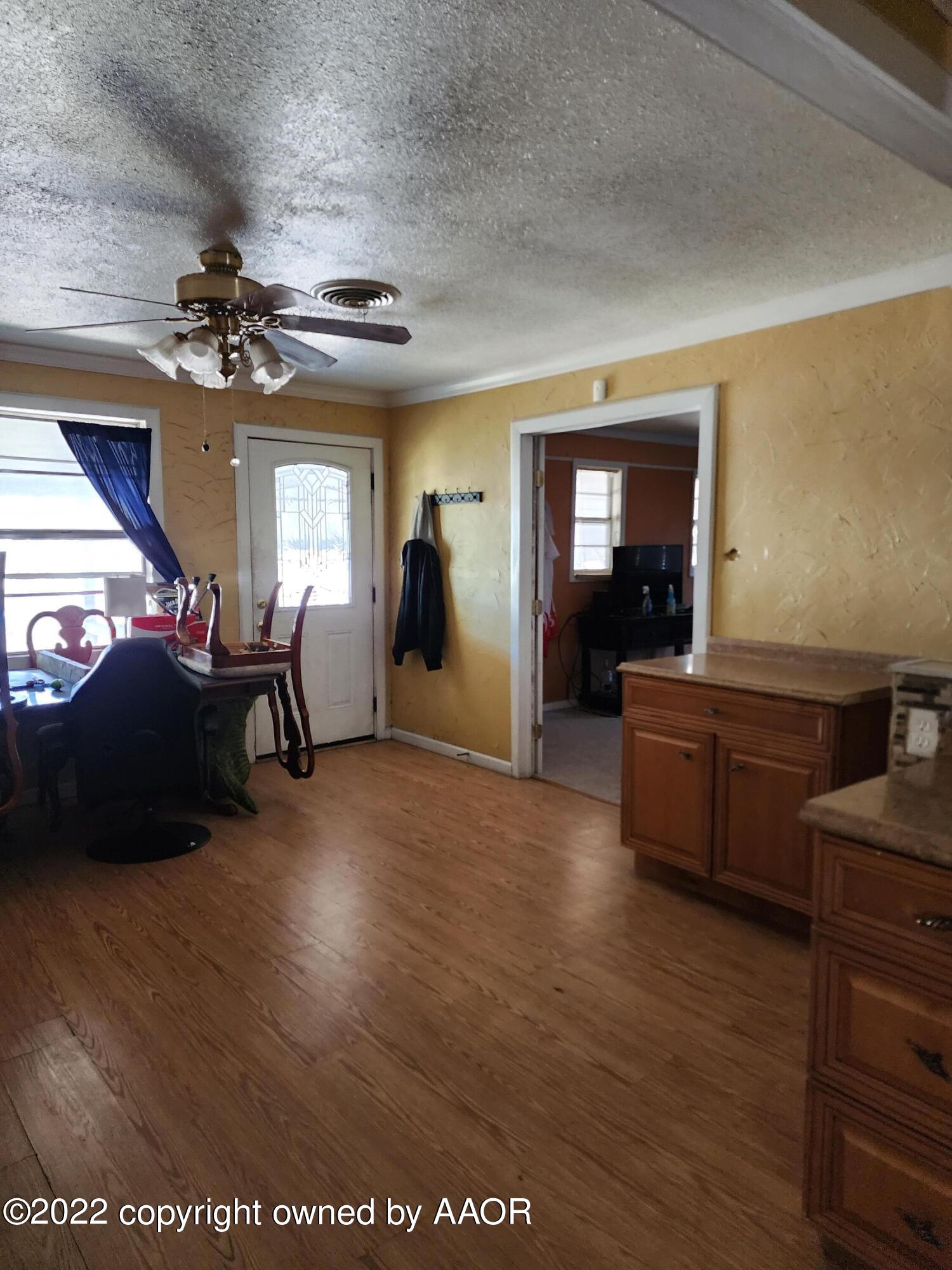 120 Pinon Street Borger, TX 79007 - Photo 6 of 19 a living room with furniture and a chandelier