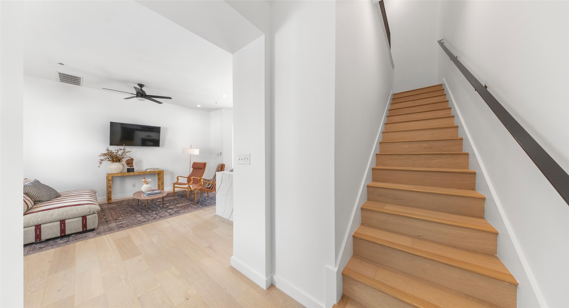 5912 Harold Court, Unit 107 Austin, TX 78721 - Photo 21 of 35 A wood-tread staircase with a comfortable landing nook — a thoughtful pause between the home's living levels. Model No. 105 Shown.