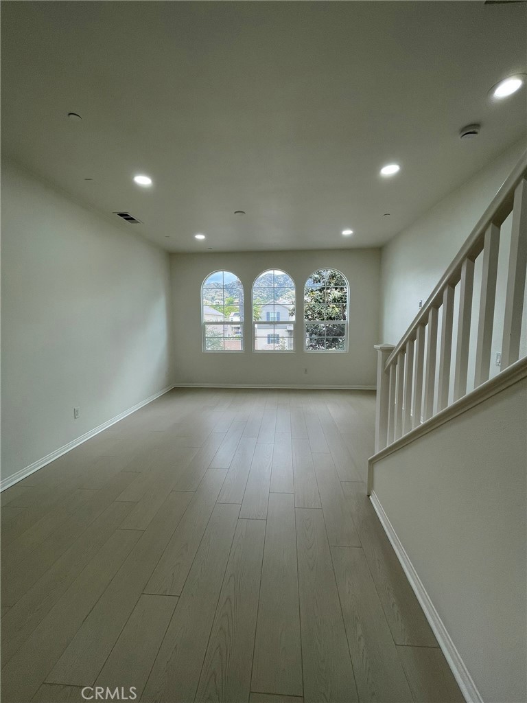 810 The Promenade, Unit C Azusa, CA 91702 - Photo 11 of 38 an empty room with windows