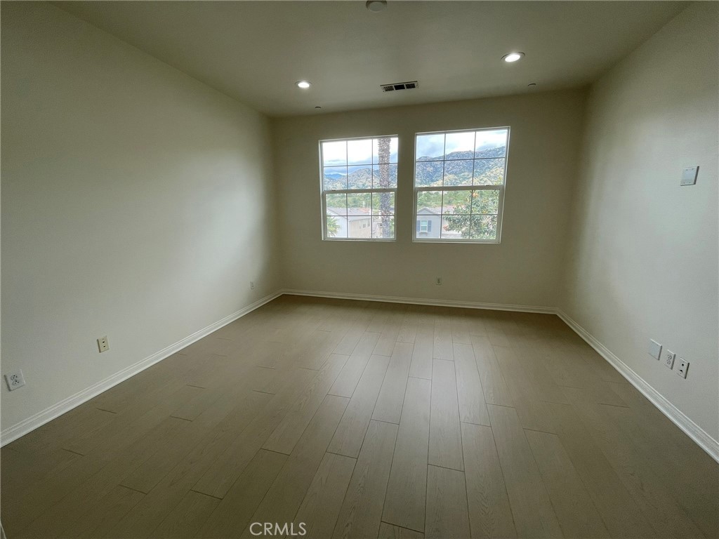 810 The Promenade, Unit C Azusa, CA 91702 - Photo 20 of 38 an empty room with a window
