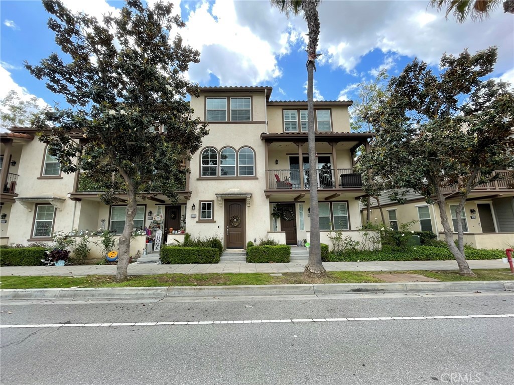 810 The Promenade, Unit C Azusa, CA 91702 - Photo 2 of 38 a front view of house with yard and green space