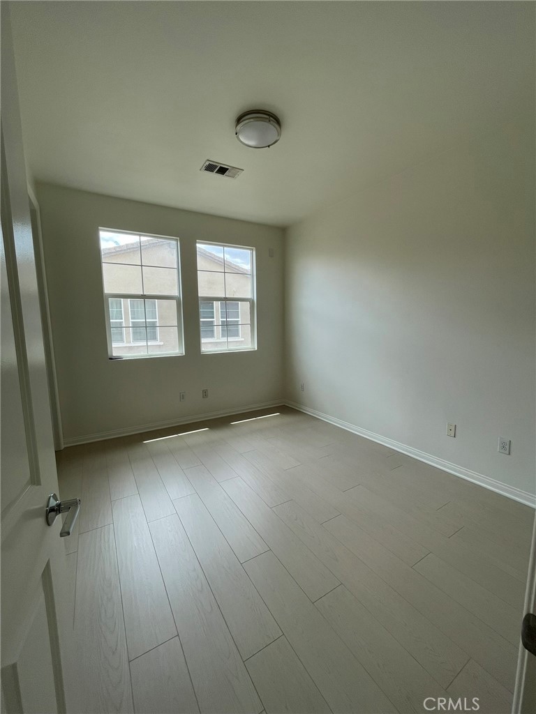 810 The Promenade, Unit C Azusa, CA 91702 - Photo 27 of 38 an empty room with a window