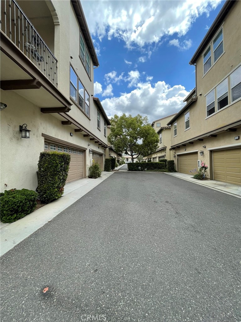 810 The Promenade, Unit C Azusa, CA 91702 - Photo 32 of 38 a view of a street with parked cars