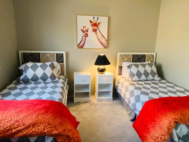 79798 Olympia Fields La Quinta, CA 92253 - Photo 17 of 25 a bedroom with a bed and a painting on the wall