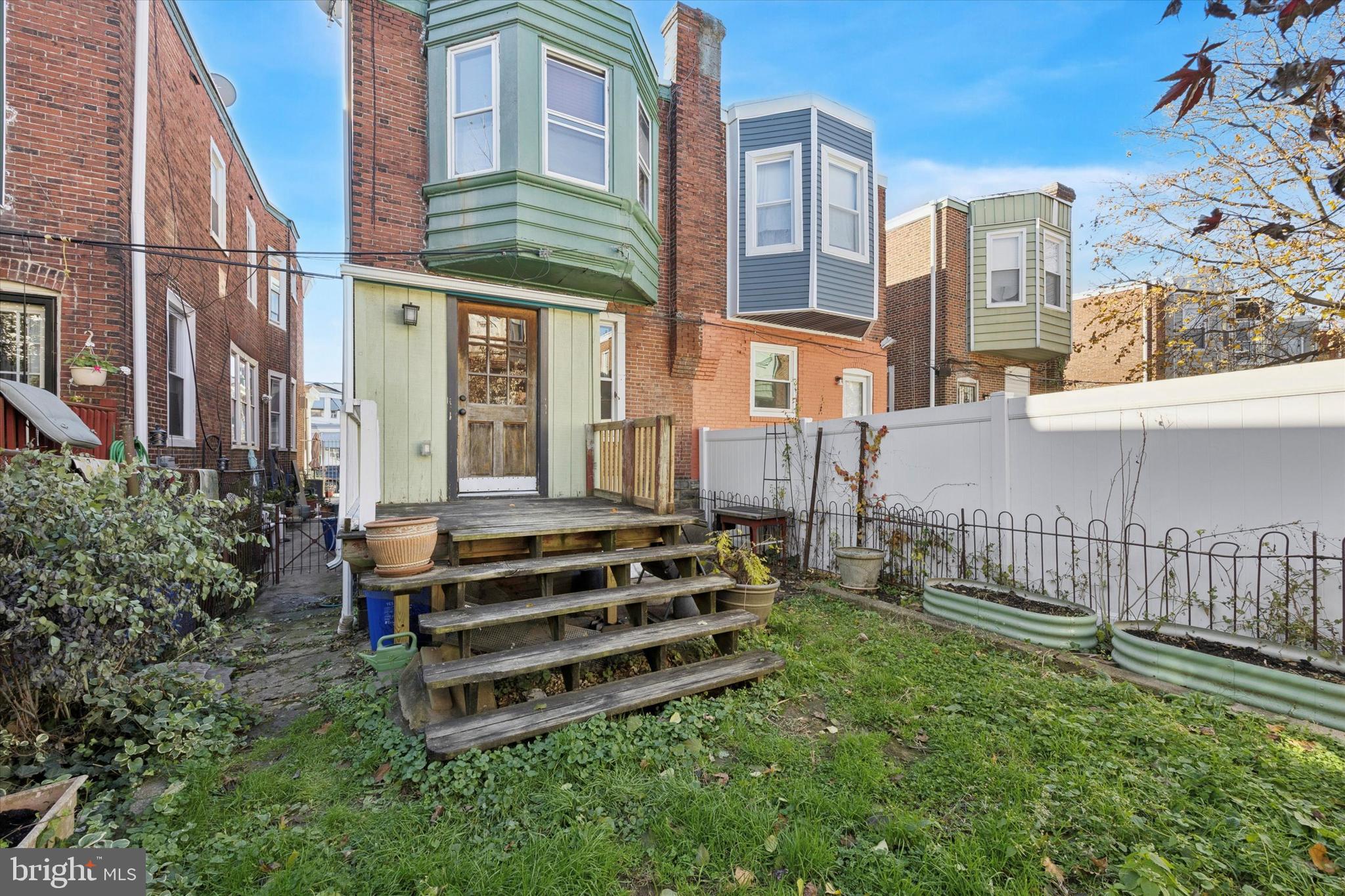 1227 South 53rd Street Philadelphia, PA 19143 - Photo 17 of 31 a view of a house with a yard and sitting area