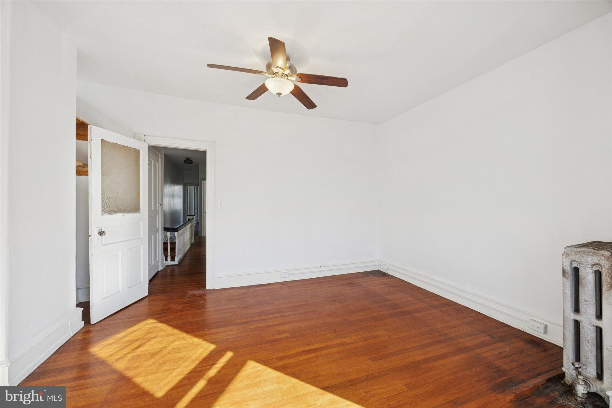 1227 South 53rd Street Philadelphia, PA 19143 - Photo 21 of 31 a view of empty room with wooden floor
