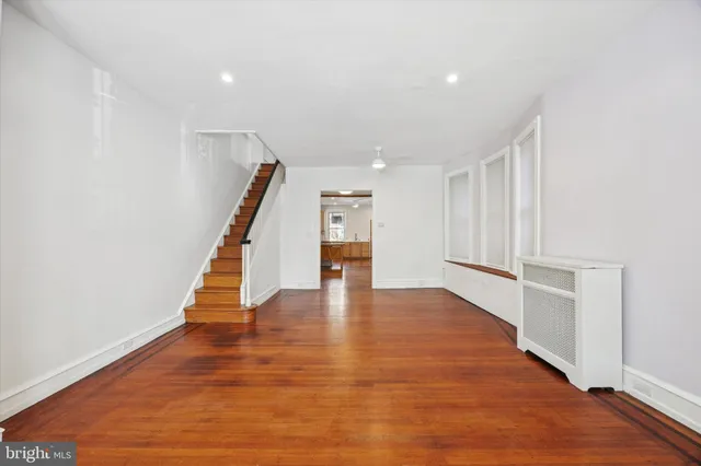 a view of an entryway with wooden floor