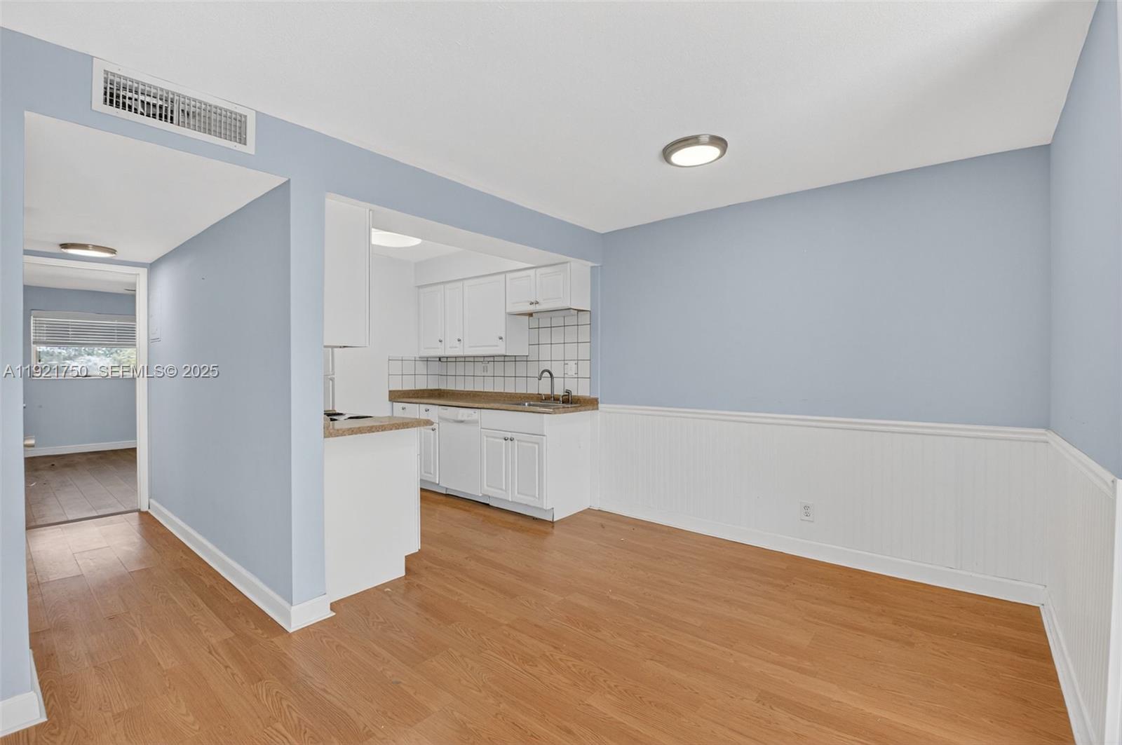 371 Southwest 8th Street, Unit 2C Boca Raton, FL 33432 - Photo 7 of 13 a view of kitchen with wooden floor