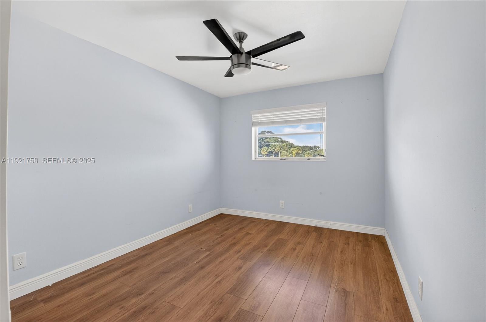 371 Southwest 8th Street, Unit 2C Boca Raton, FL 33432 - Photo 9 of 13 wooden floor in an empty room