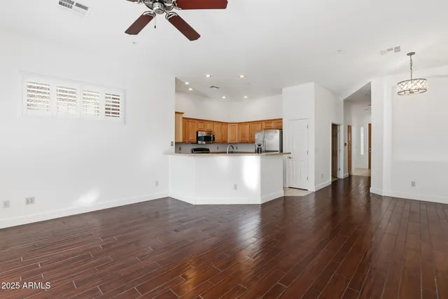 a view of a kitchen with a dishwasher cabinets and a wooden floor