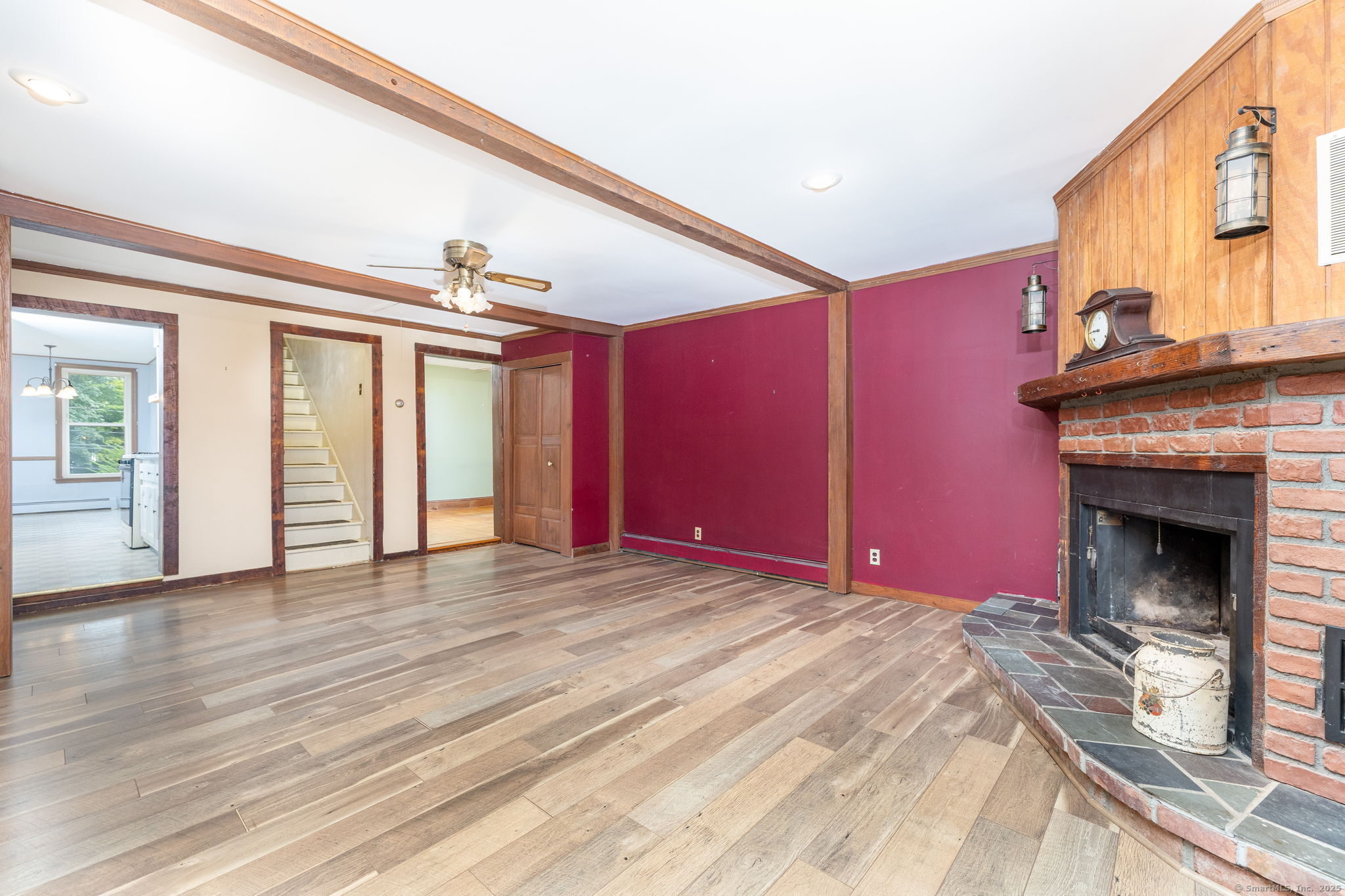 548 Worthington Ridge Berlin, CT 06037 - Photo 12 of 40 a view of an empty room with wooden floor fireplace and a window