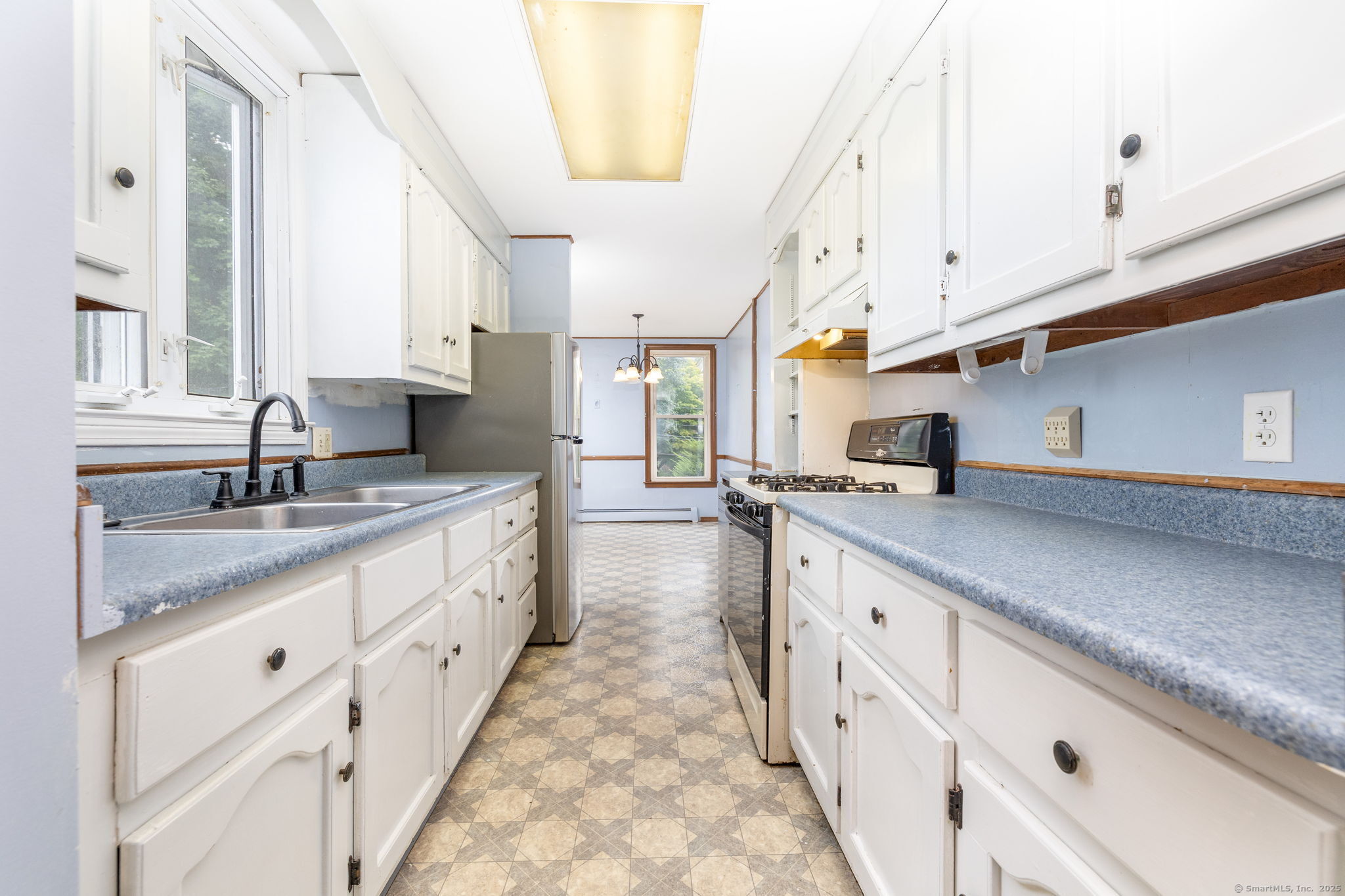 548 Worthington Ridge Berlin, CT 06037 - Photo 16 of 40 a large white kitchen with granite countertop a sink white cabinets and a granite counter tops