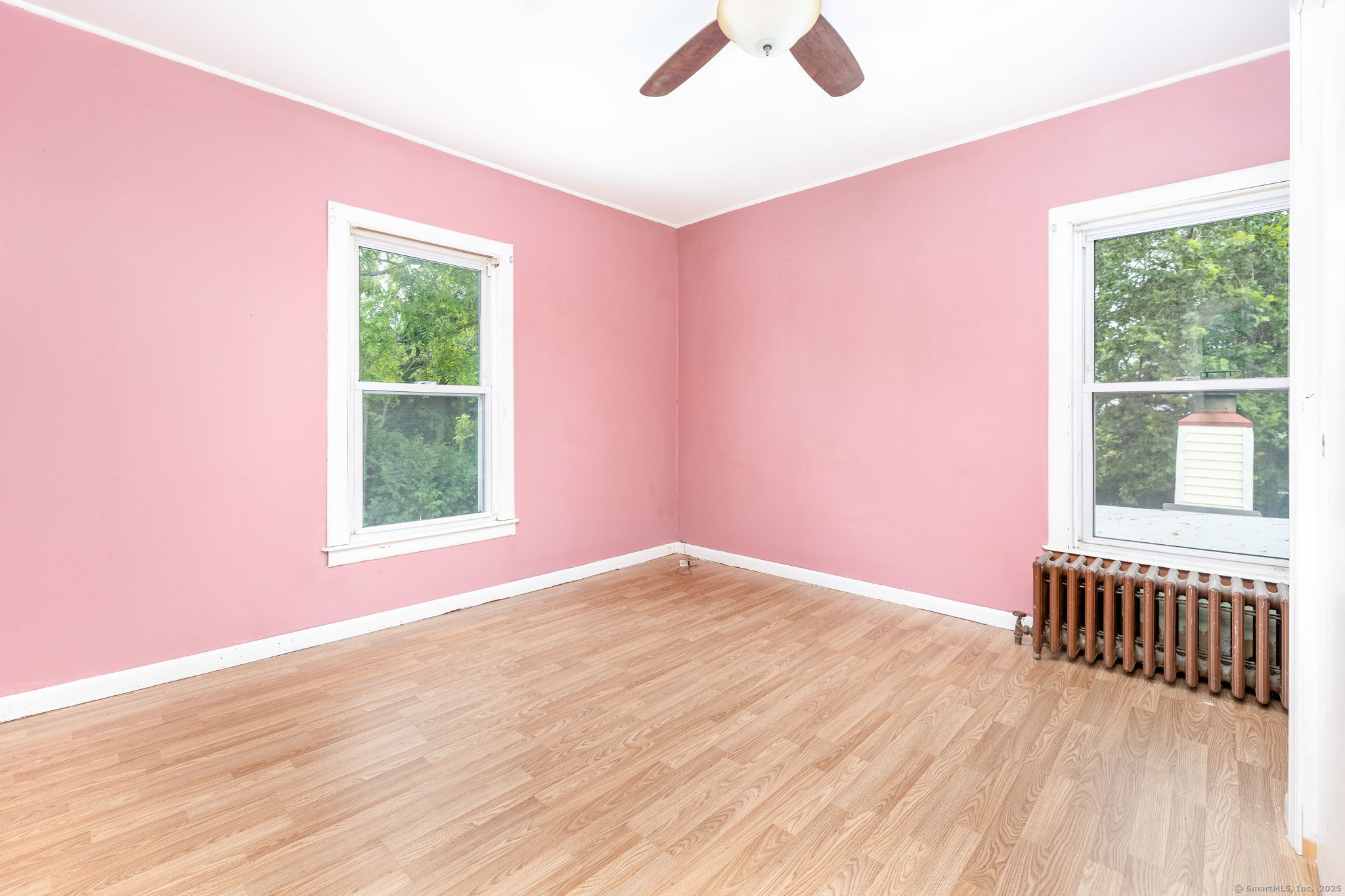 548 Worthington Ridge Berlin, CT 06037 - Photo 19 of 40 a view of an empty room with wooden floor and a window