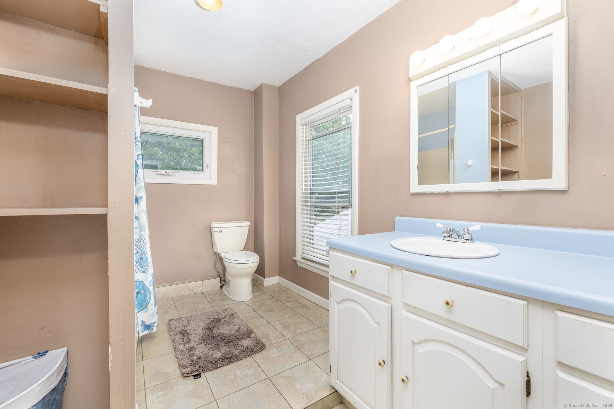 548 Worthington Ridge Berlin, CT 06037 - Photo 25 of 40 a bathroom with a granite countertop sink a toilet and a mirror