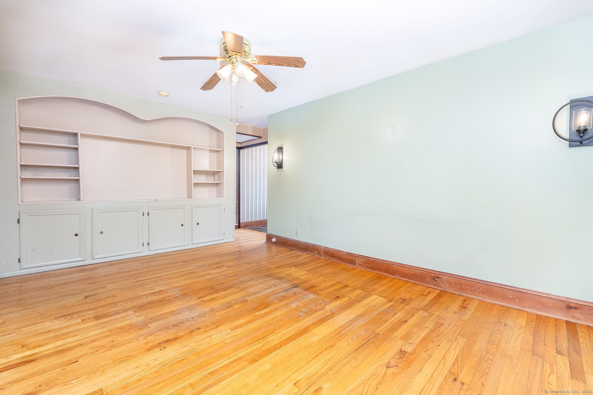 548 Worthington Ridge Berlin, CT 06037 - Photo 7 of 40 a view of a room with wooden floor and ceiling fan