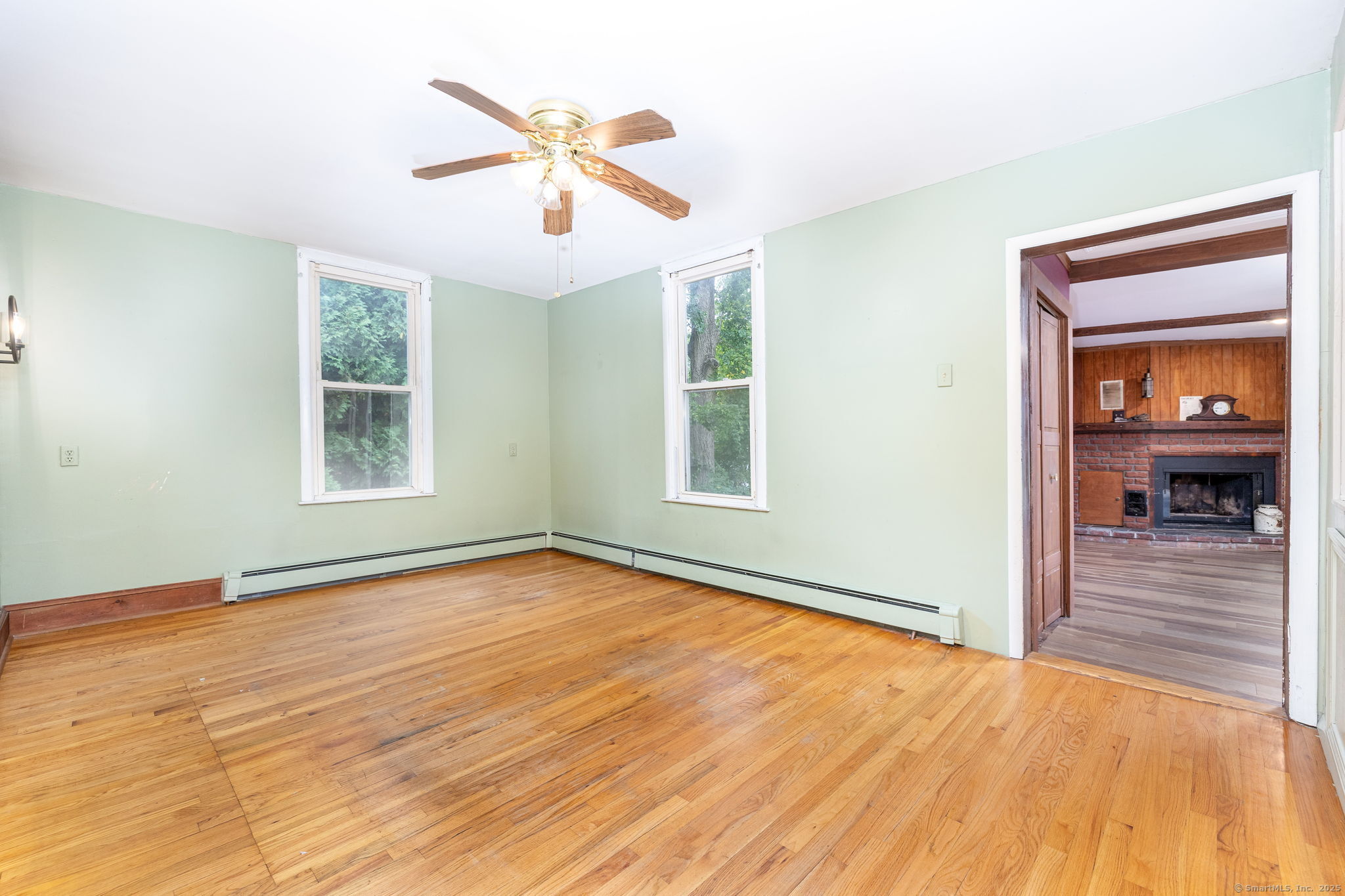 548 Worthington Ridge Berlin, CT 06037 - Photo 9 of 40 a view of an empty room with wooden floor and a window