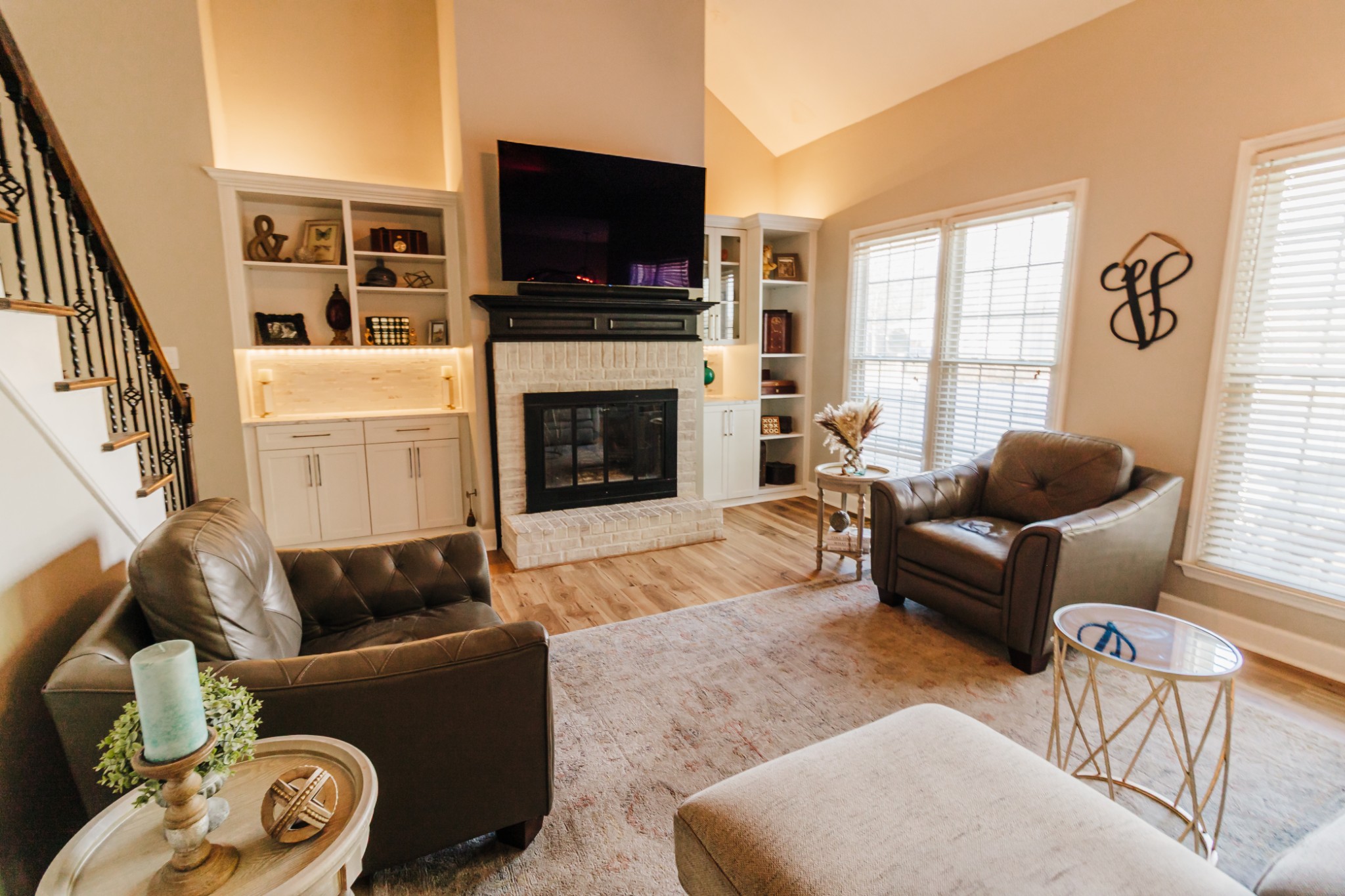 203 Savannah Ridge Murfreesboro, TN 37127 - Photo 14 of 60 a living room with furniture a flat screen tv and a fireplace