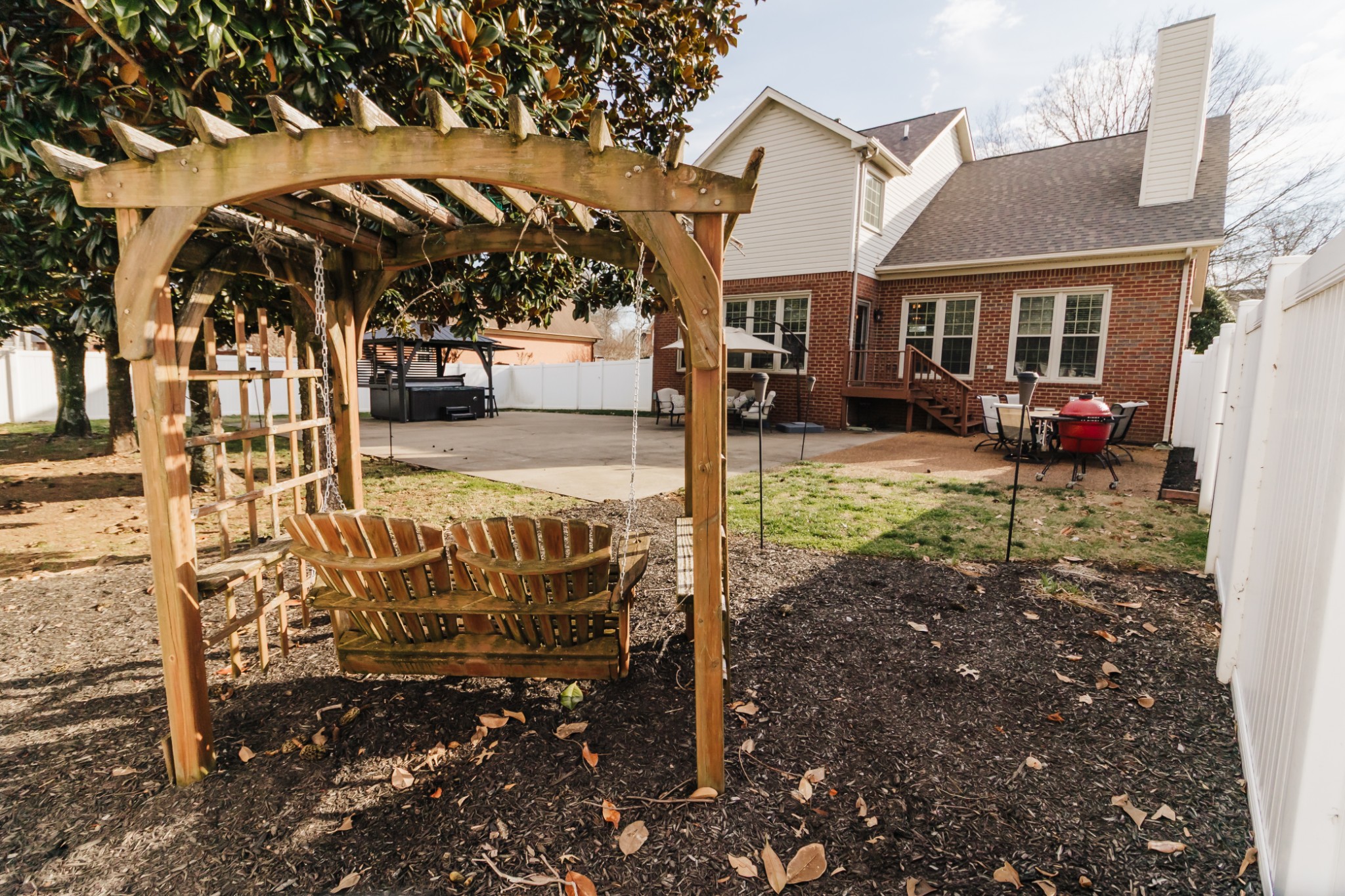 203 Savannah Ridge Murfreesboro, TN 37127 - Photo 49 of 60 a view of a house with backyard porch and sitting area