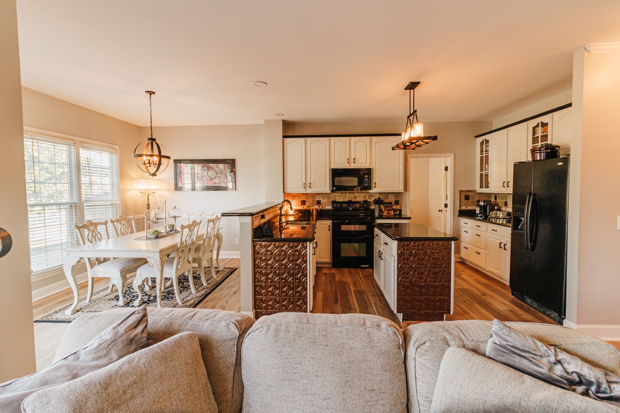 203 Savannah Ridge Murfreesboro, TN 37127 - Photo 9 of 60 a living room with furniture a flat screen tv and kitchen view