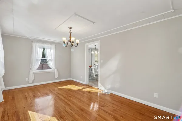 a view of a chandelier in an empty room