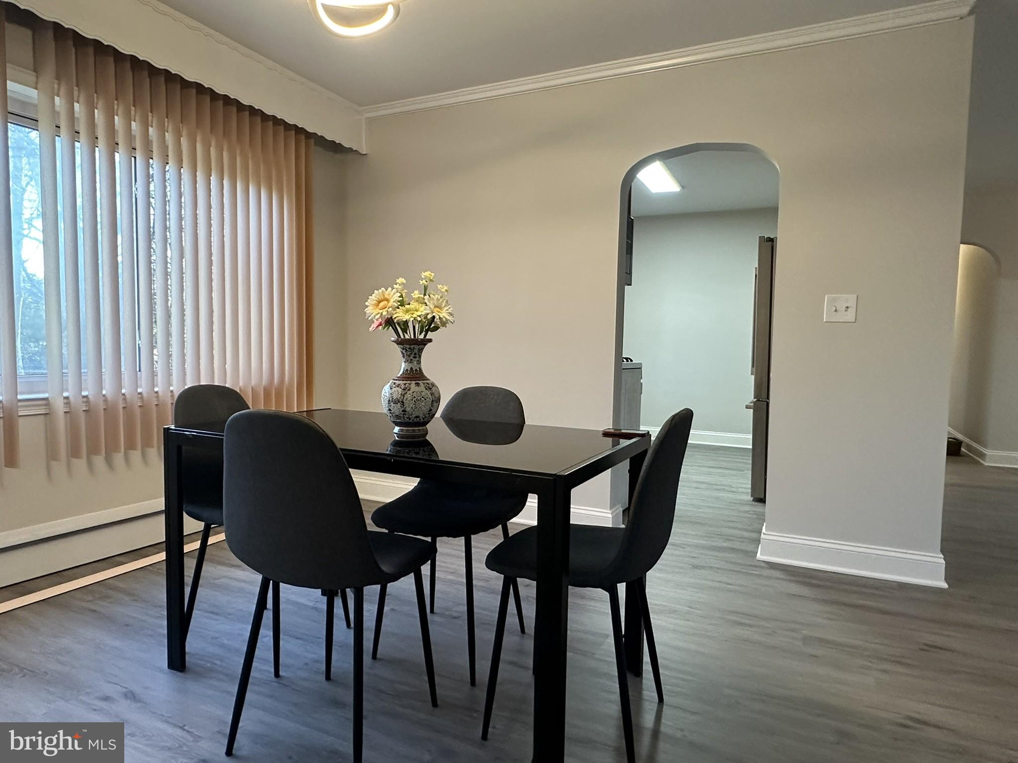 4121 Villa Nova Road Baltimore, MD 21207 - Photo 14 of 57 a view of a dining room with furniture and wooden floor