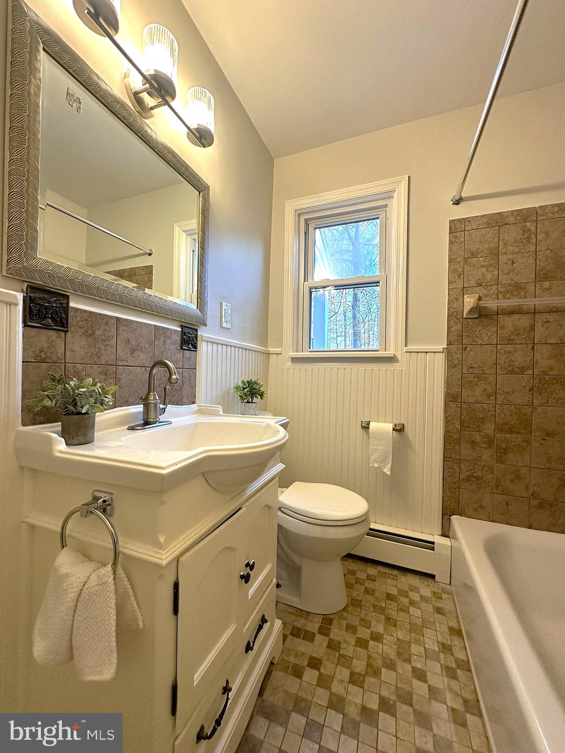 4121 Villa Nova Road Baltimore, MD 21207 - Photo 30 of 57 a bathroom with a sink a toilet and shower