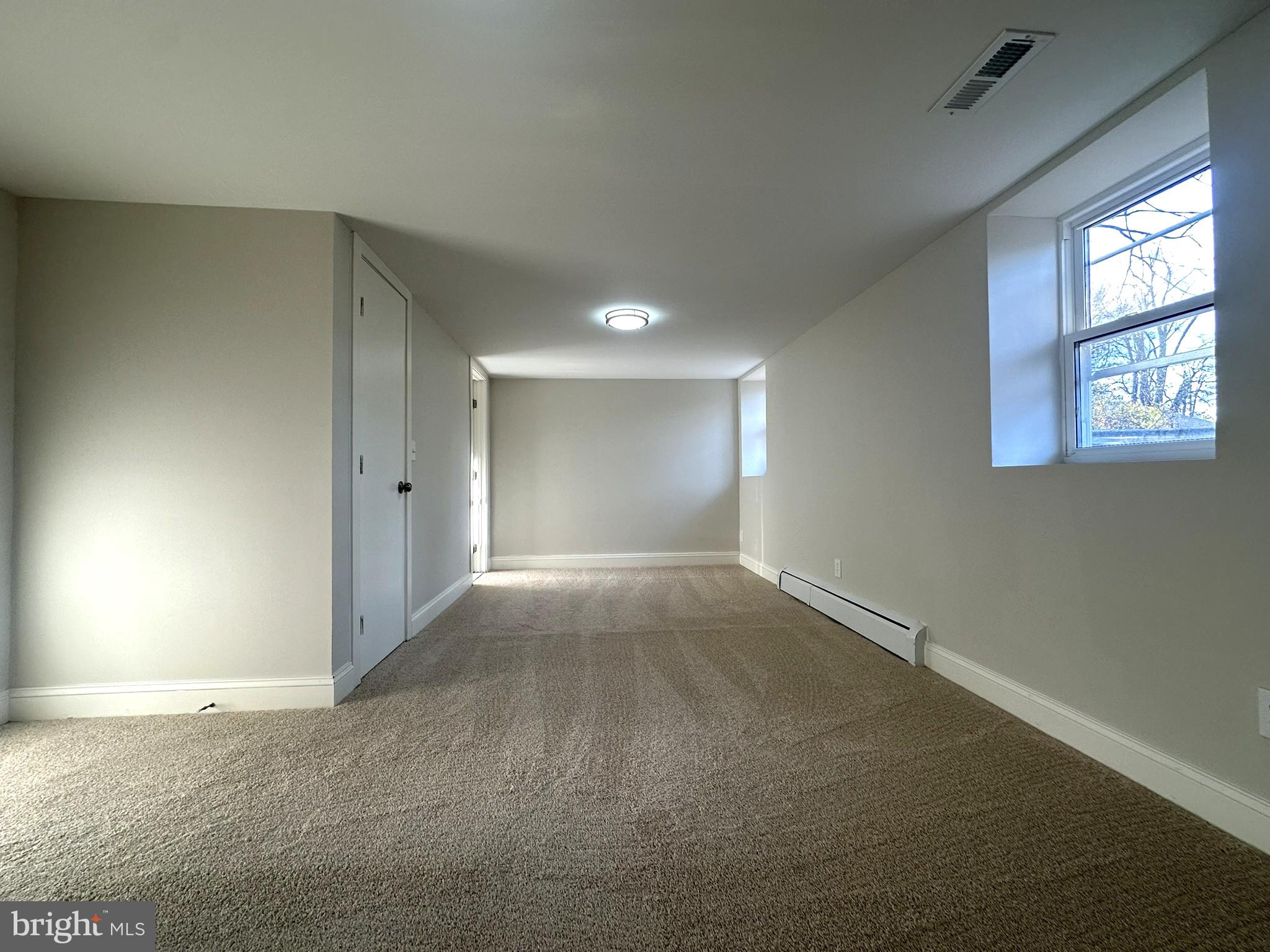 4121 Villa Nova Road Baltimore, MD 21207 - Photo 34 of 57 a view of an empty room and window