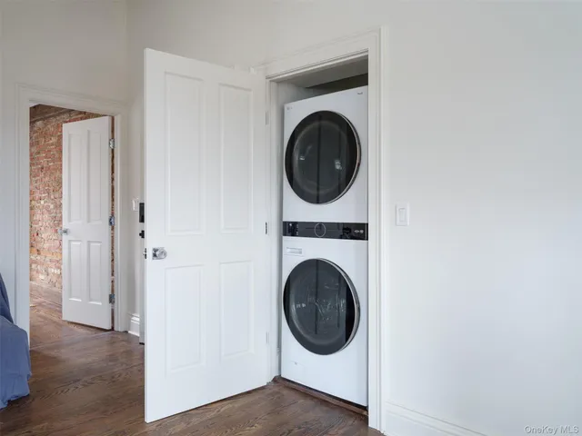 a view of a hallway with washer and dryer