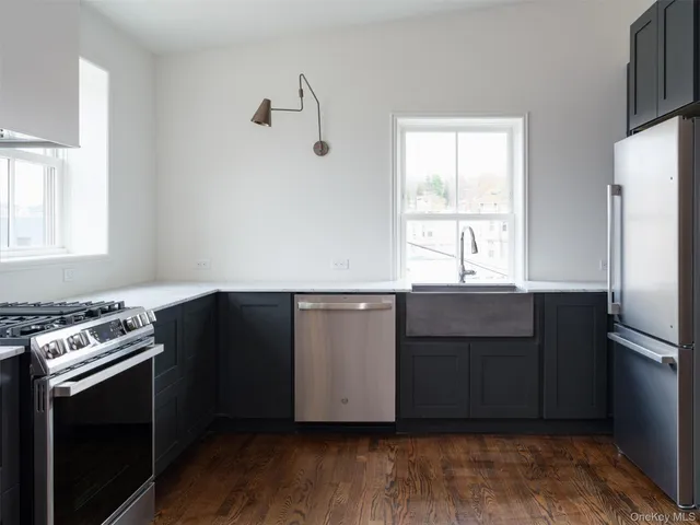 a kitchen with a cabinets and wooden floor