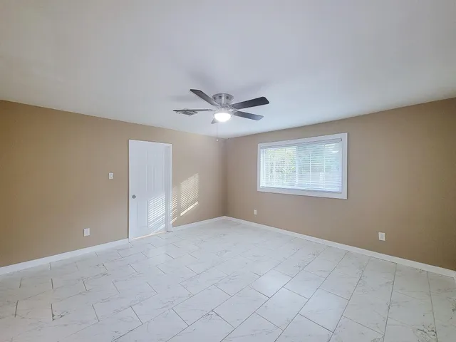 a view of an empty room with a window