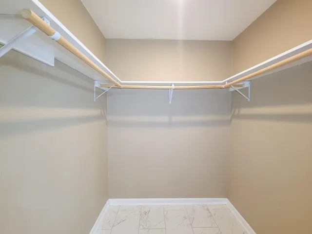 a view of an empty walk in closet