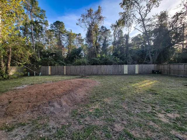 a view of a backyard with a small cabin