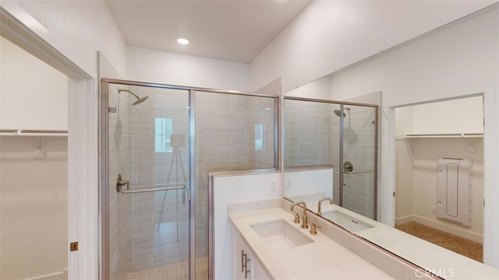 1689 Intrepid Lane San Pedro, CA 90732 - Photo 24 of 51 a bathroom with a shower sink vanity and mirror