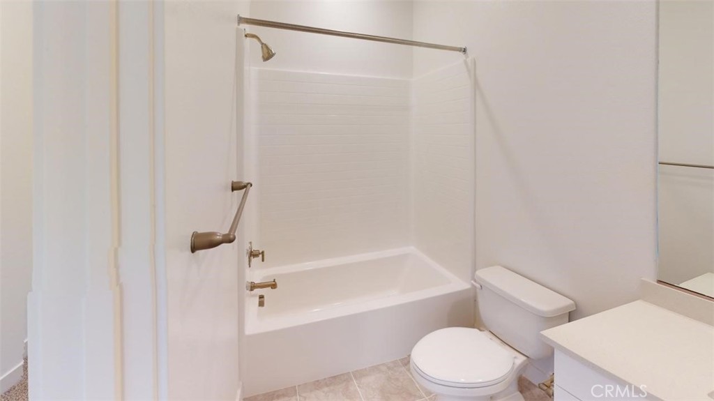 1689 Intrepid Lane San Pedro, CA 90732 - Photo 36 of 51 a white toilet and tub next to a white cabinet