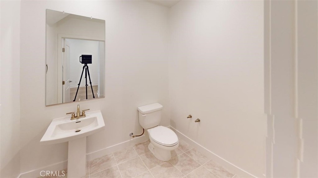1689 Intrepid Lane San Pedro, CA 90732 - Photo 38 of 51 a bathroom with a sink a toilet and mirror