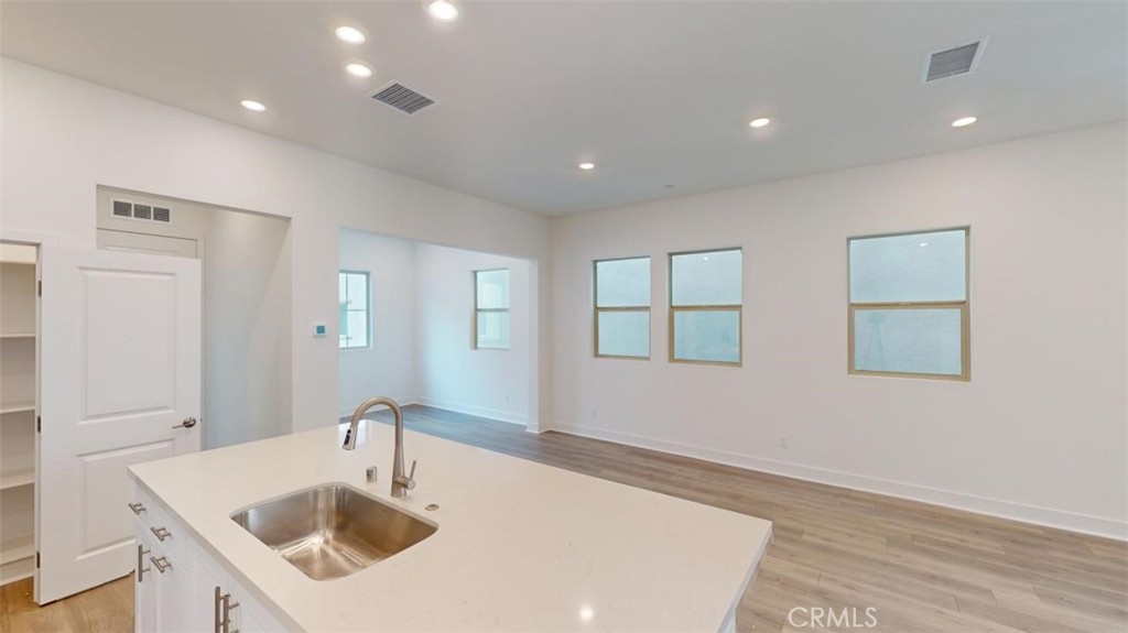 1689 Intrepid Lane San Pedro, CA 90732 - Photo 6 of 51 a kitchen with a sink and chandelier