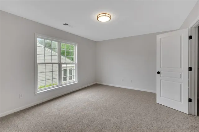 a bathroom with a bathtub shower sink vanity and toilet