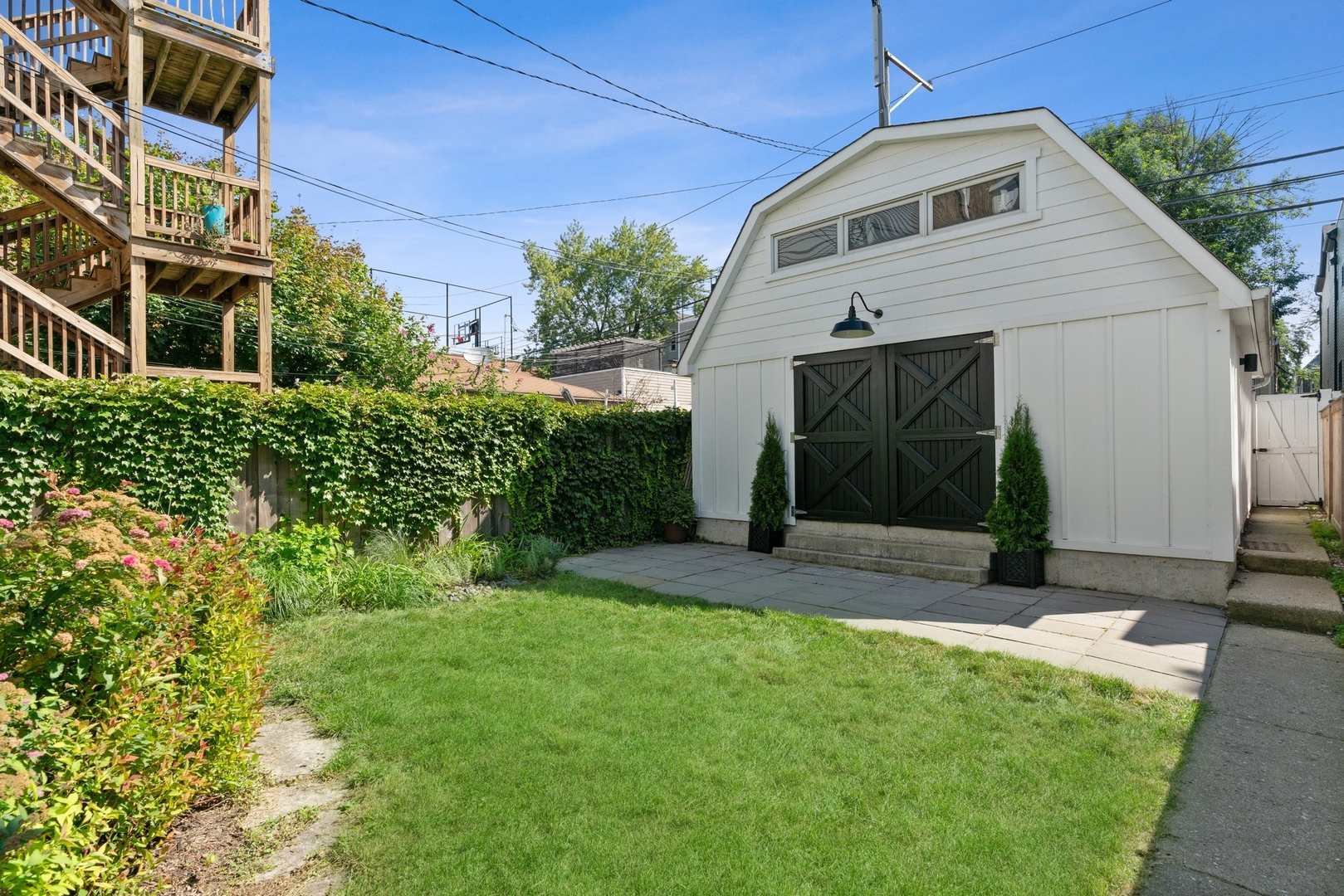 3317 North Bell Avenue Chicago, IL 60618 - Photo 13 of 30 a front view of a house with a yard